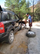 our driver and guide changing a wheel, the roads are challenging
